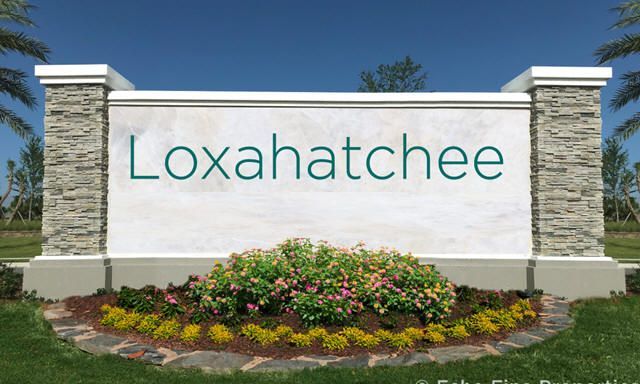 A white sign that says loxahatchee on it