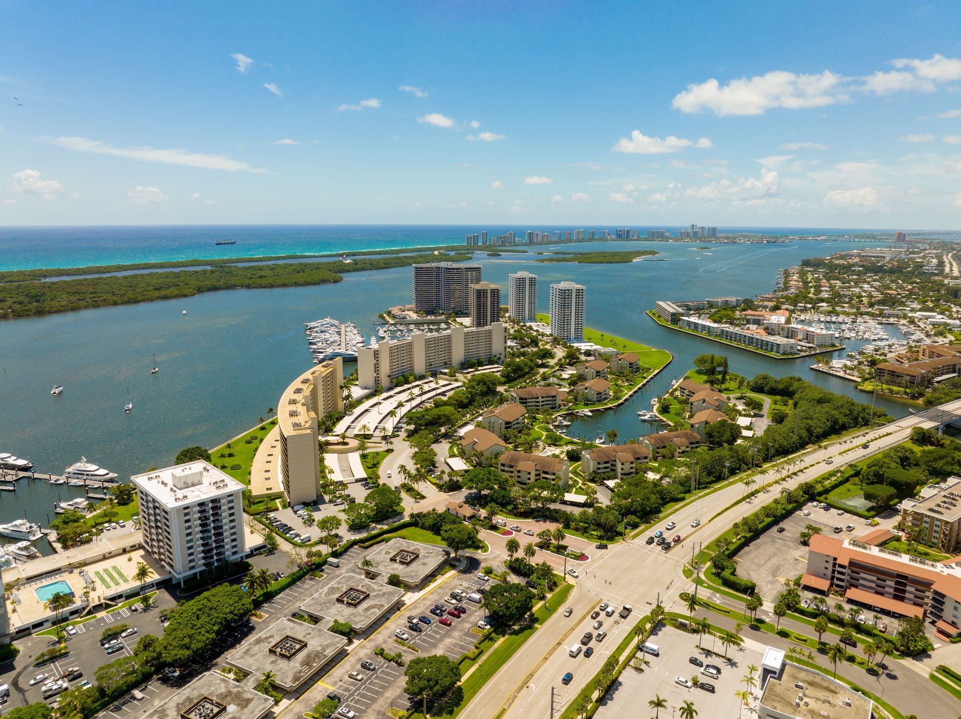 An aerial view of a city surrounded by water and buildings.