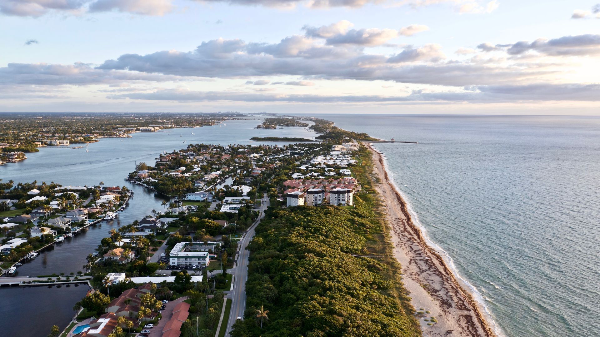 An aerial view of a residential area next to the ocean.